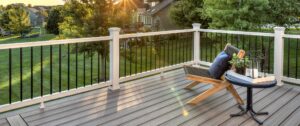 Light gray composite deck with a chair and table on top of it